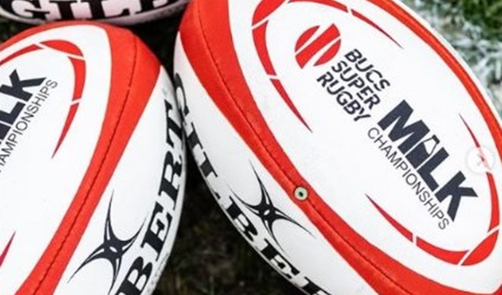 Red and white BUCS Milk Championships rugby balls.
